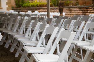 Folding white wodden chairs