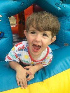 Boy playing inside a bounce house